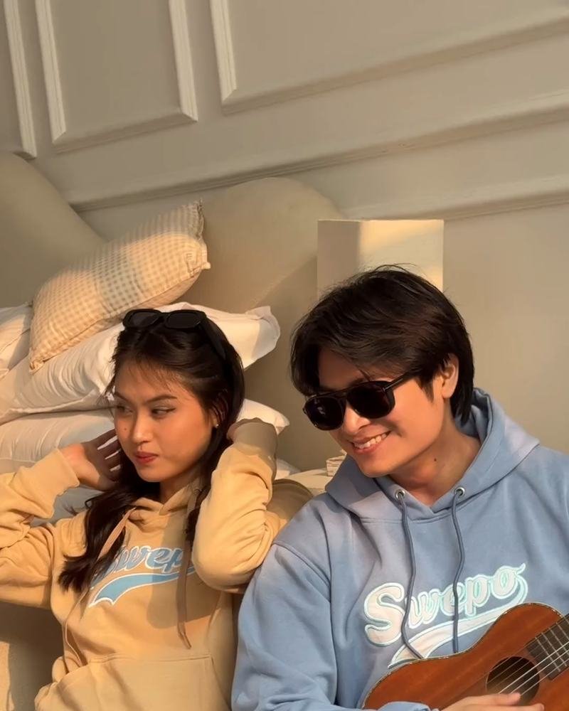 Adha Gozali and another model in Swepo hoodies, Adha holding a ukulele.